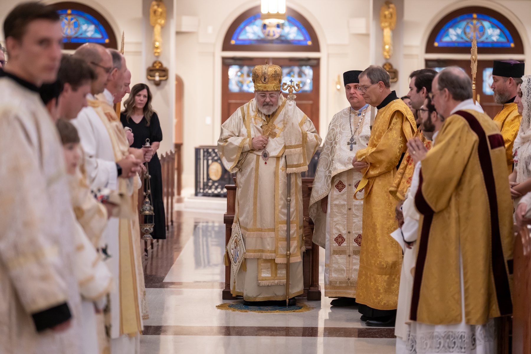 The bishop is received in the middle of the church
